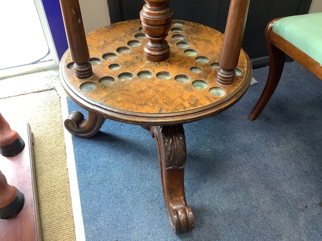 A Victorian walnut and burr walnut revolving billiard cue stand, diameter 56cm height 144cm